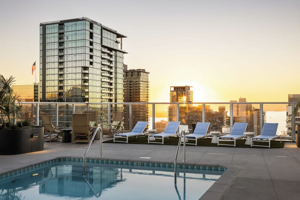Rooftop pool with ample lounging area.