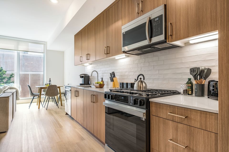 Modern kitchen with ample wooden cabinetry.