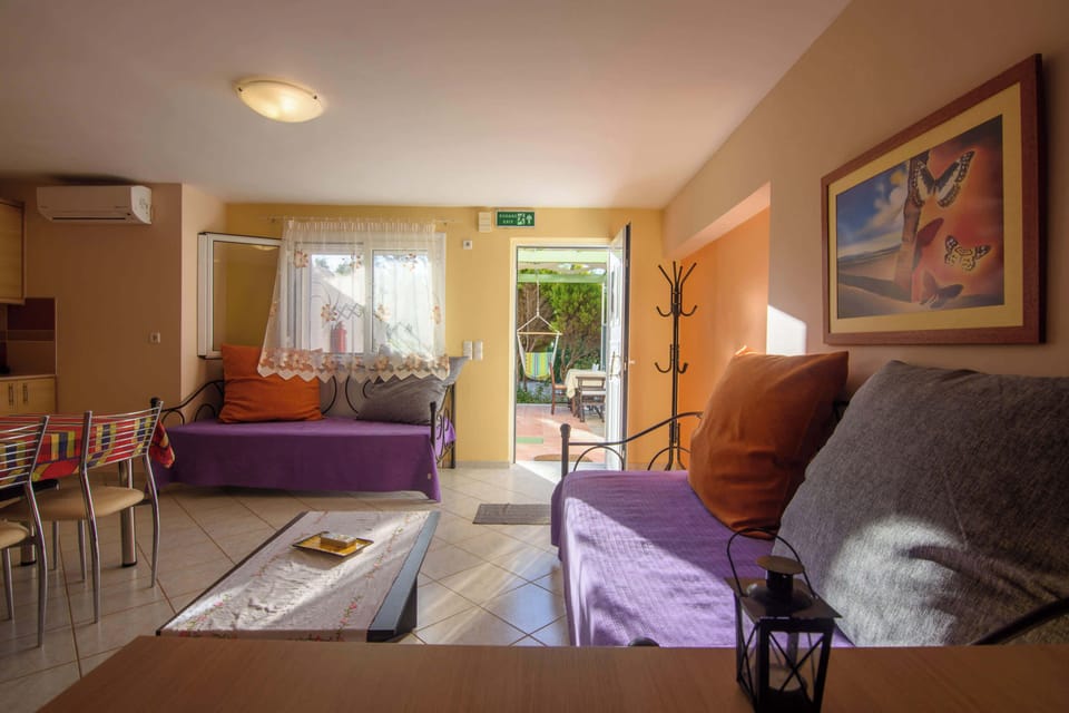 Comfortable Living Room with Sofa and Garden Access
