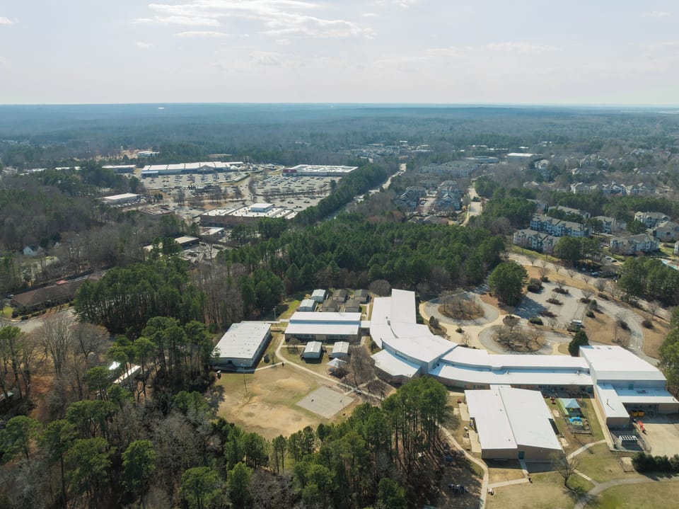 Aerial view of the neighborhood and surrounding Raleigh area.