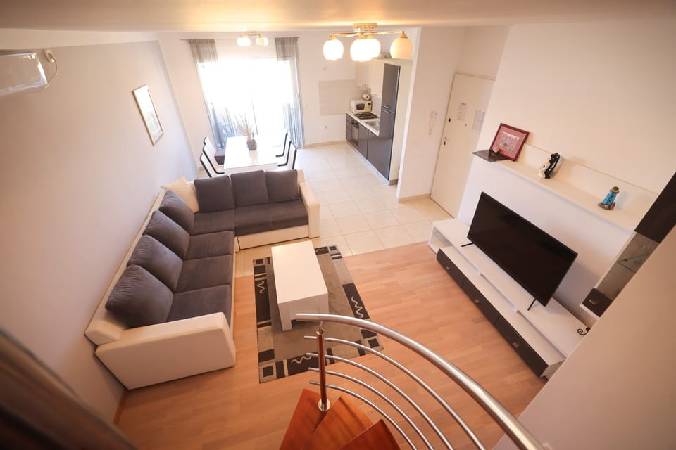 Comfort Apartment, Partial Sea View | Living area | 100-cm Smart TV with satellite channels