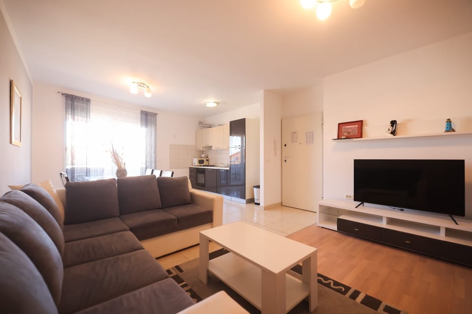 Comfort Apartment, Partial Sea View | Living area | 100-cm Smart TV with satellite channels