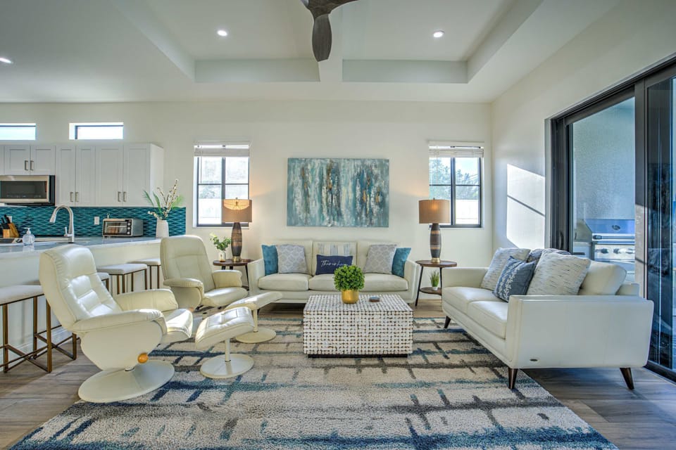 Spacious, open-concept add pool view living room designed for comfort and relaxation.
