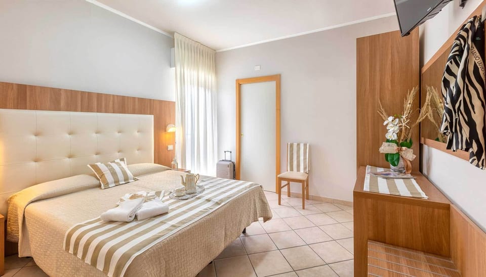 Basic Triple Room, Balcony | In-room safe, desk, free WiFi