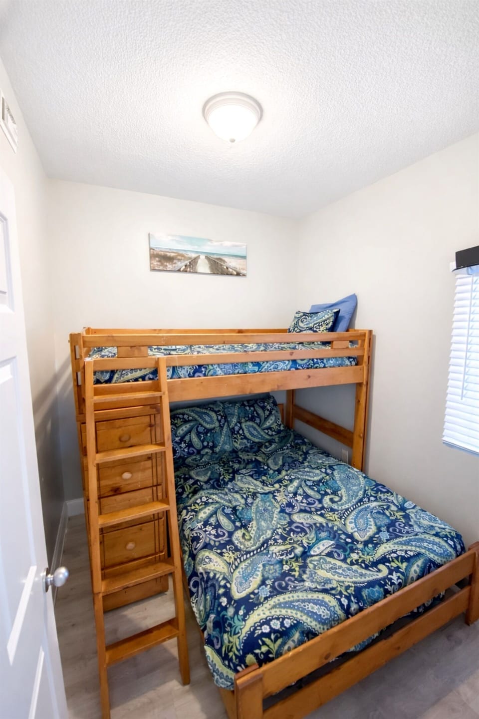 Bunkroom has a double bed with a twin bunk above it and is only a few steps from the second bath. There is a wall-mounted flat screen TV in here as well!
