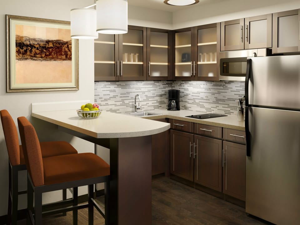 Full-size fridge, microwave, coffee/tea maker, cookware/dishes/utensils