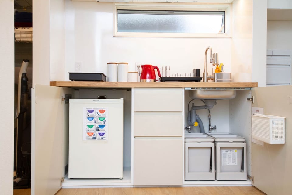 Handy under-sink storage and fridge for convenience.