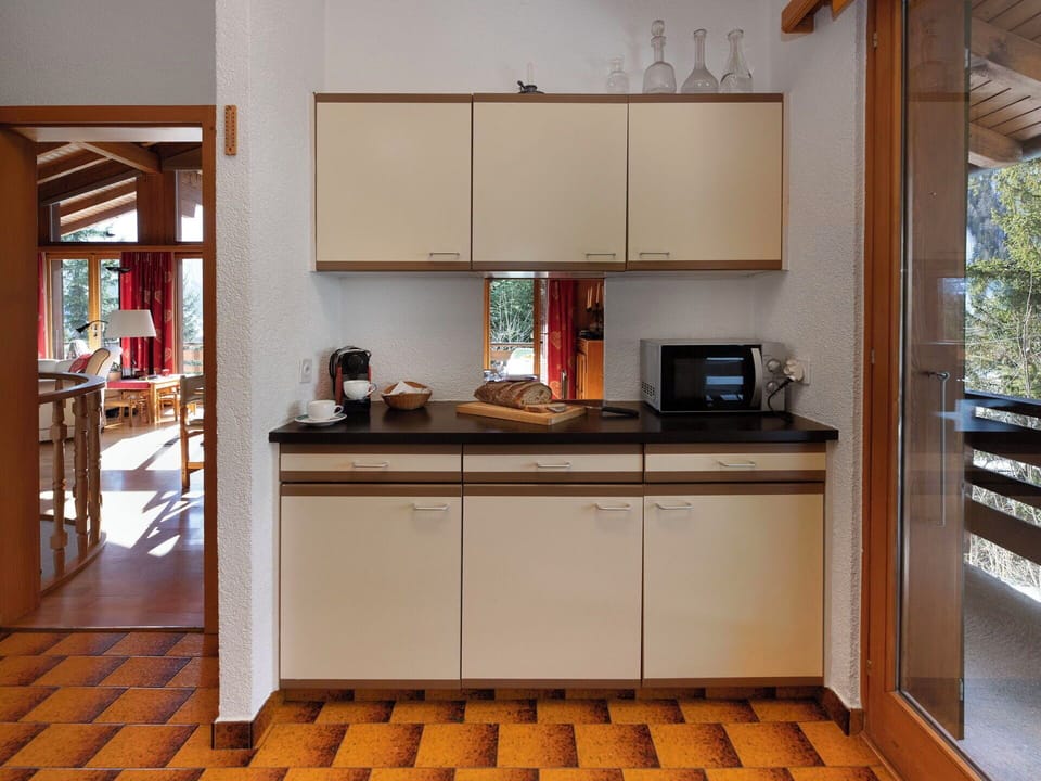Kitchen, Furniture, Wood, Interior Design, Countertop, Flooring, Kitchen Appliance, Cabinetry, Floor, Lighting