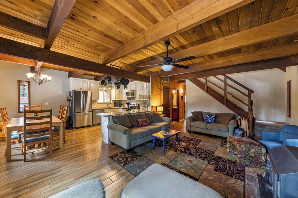 Relax under stunning timber beams in your spacious open-plan living area, where rustic charm meets modern comfort perfectly.