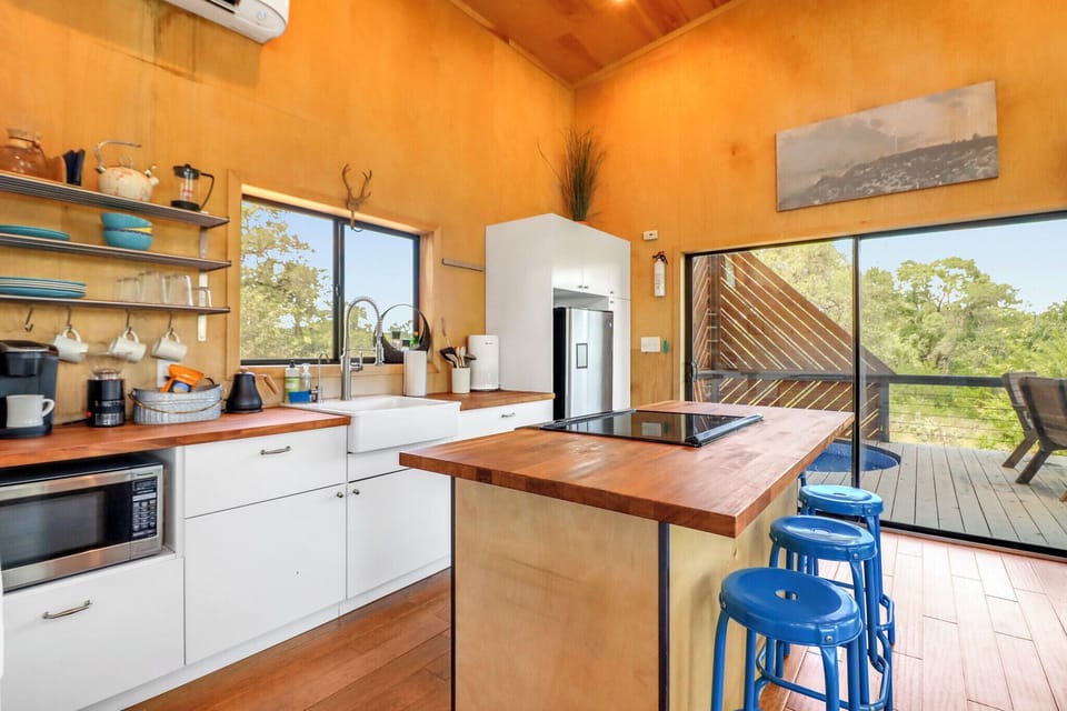 Open-concept kitchen featuring natural light and warm finishes, perfect for cooking and gathering