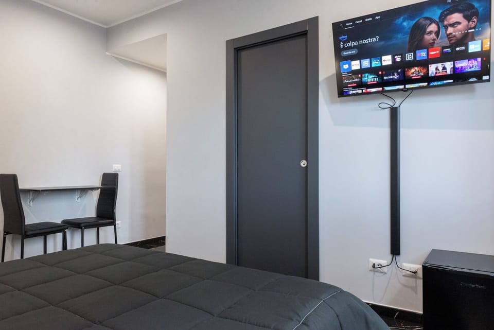 Deluxe Triple Room, 1 King Bed with Sofa bed, Private Bathroom | In-room safe, desk, laptop workspace, blackout drapes