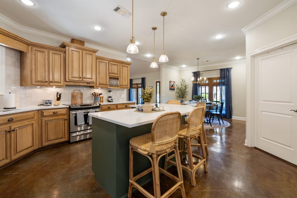 Cook, gather, and sip — the spacious island with bar seating makes the kitchen the heart of the home.