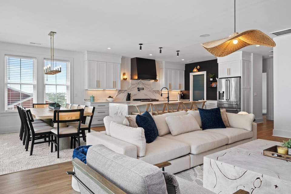 Relax in your spacious open-plan living area where modern elegance meets comfort—perfect for gathering with loved ones.