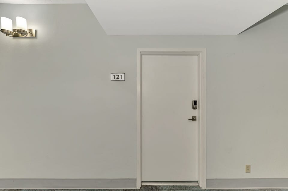 Your private entrance awaits behind door 121, leading to your comfortable retreat with modern amenities and thoughtful touches.