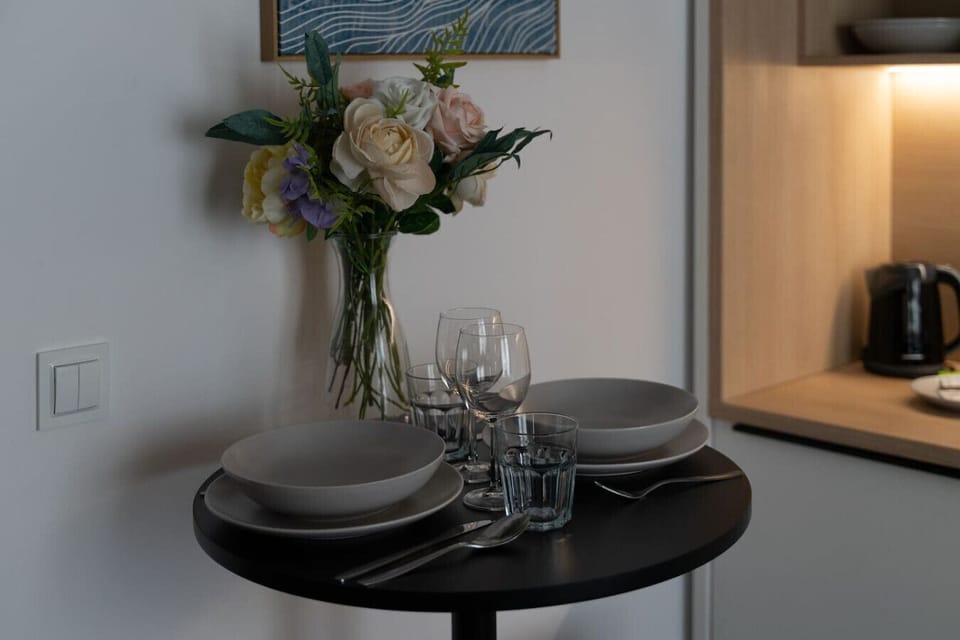 Cozy Dining Corner with Table Setting for Two | Book Now with RENTUJEMY.COM