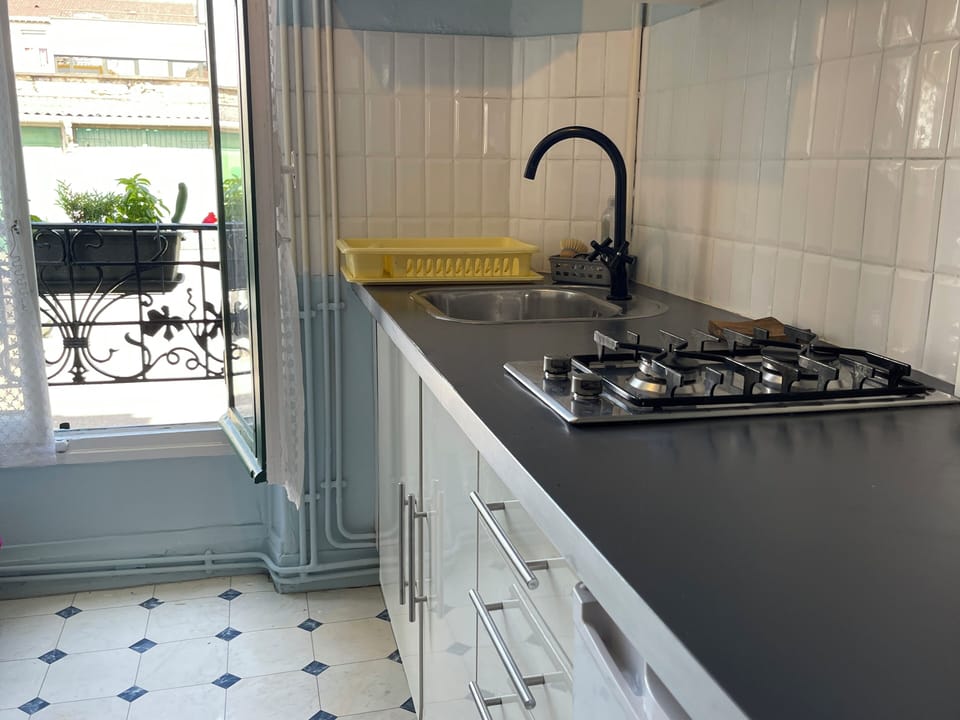 Kitchen and widow outside garden and parking
