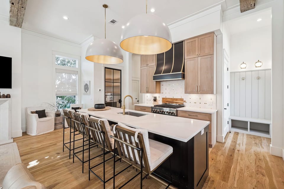 Your dream kitchen awaits with a spacious island, pendant lighting, and open flow to the living area—perfect for cooking and gathering.