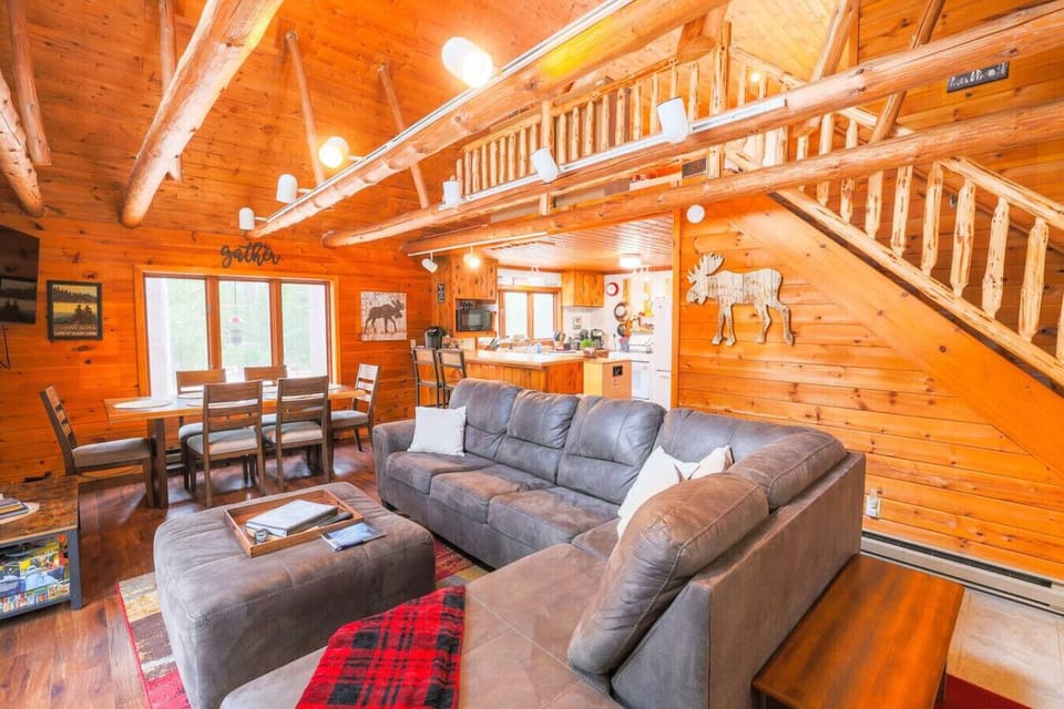 Open Living Room | Great views of the woods | Gas fireplace | Super comfortable sectional couch w/ Queen sleeper | 50` TV | Games & books