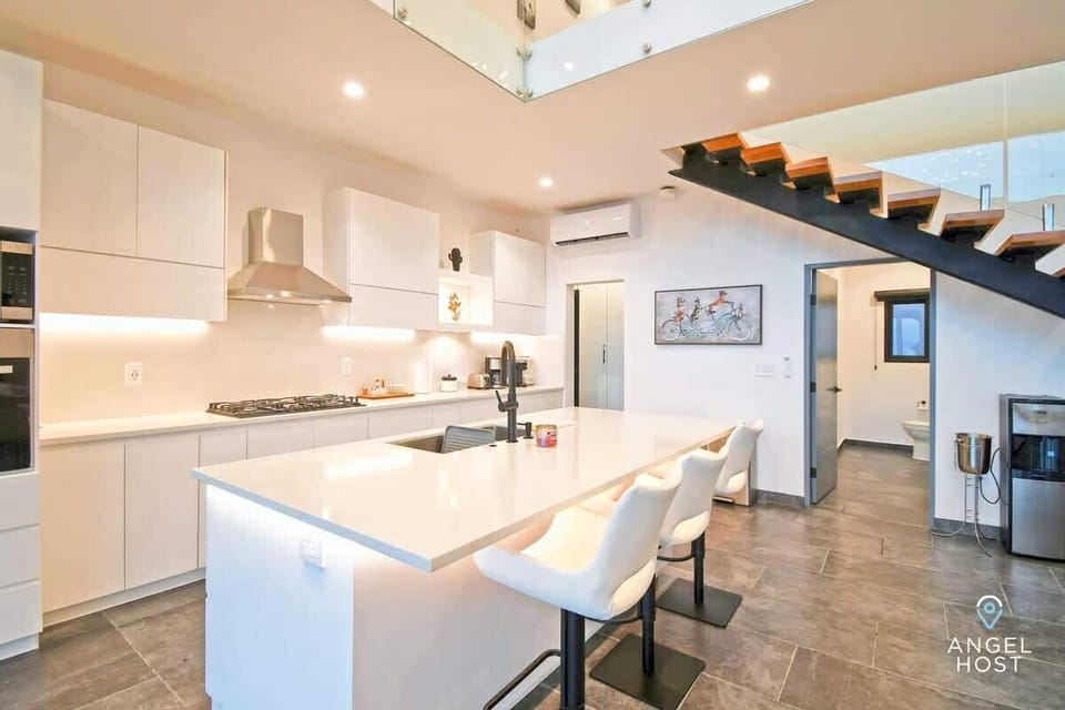 Three stools at the breakfast bar, perfect for casual dining.