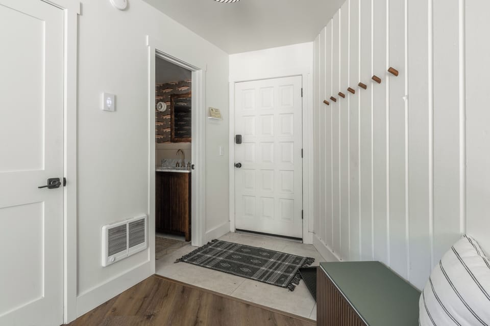 Your fresh entrance welcomes you home with clean lines, warm wood touches, and thoughtful details that set the tone for relaxation.
