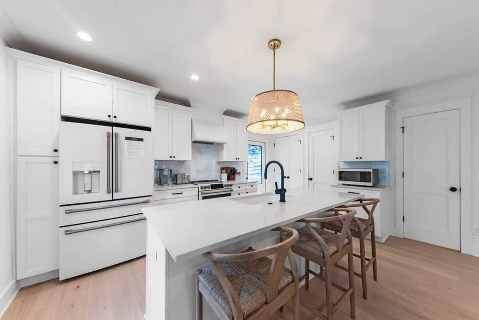 Have a few drinks at the kitchen island while watching the designated chef in action.