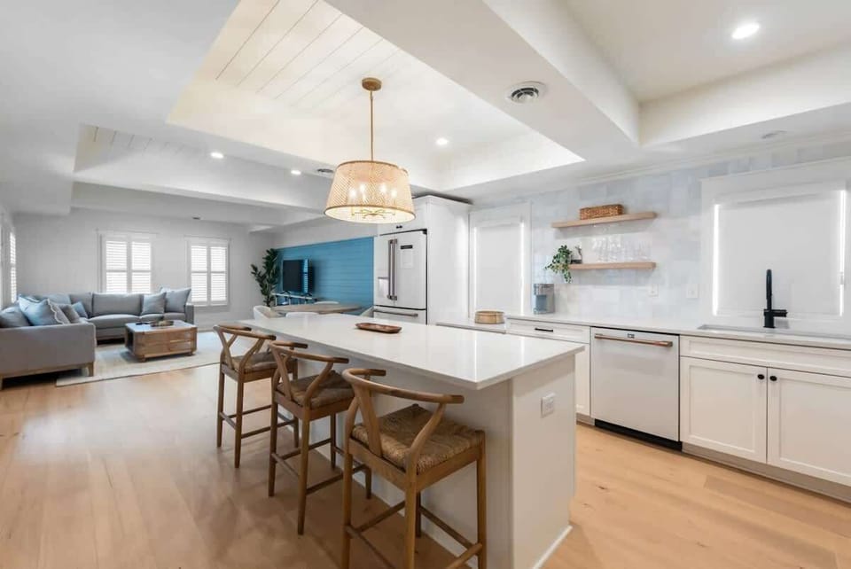 A stunning chef’s kitchen with bright interiors and a spacious island for gathering.