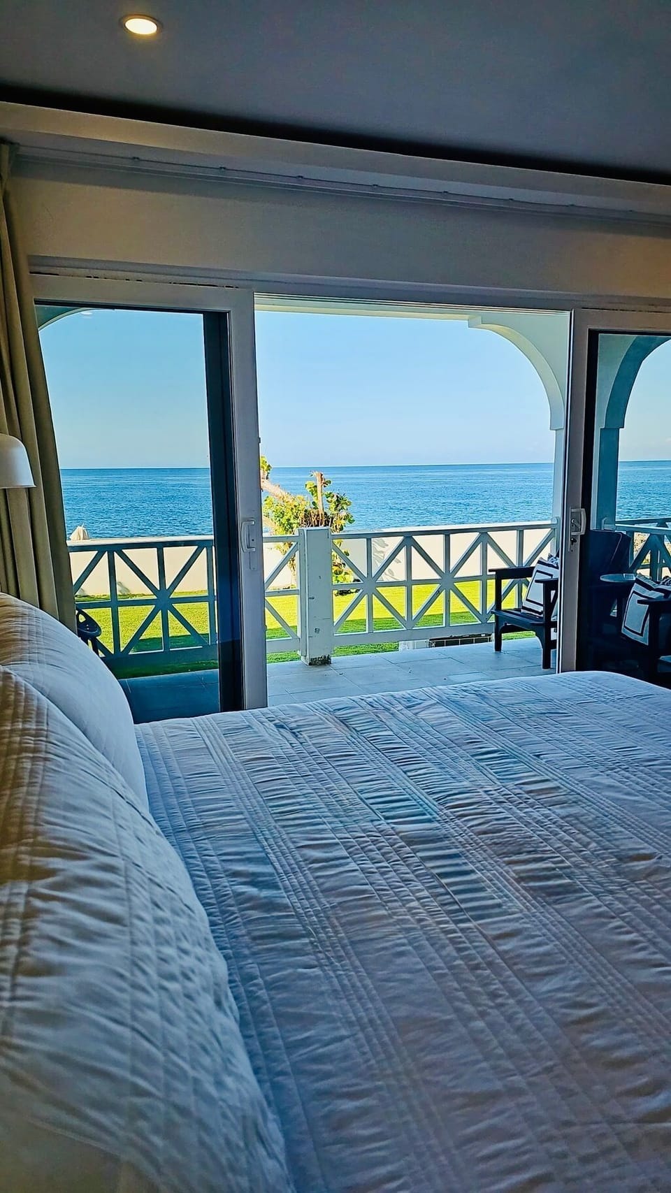 room, indoor, summer, bed, balcony, private space, body of water, unit views