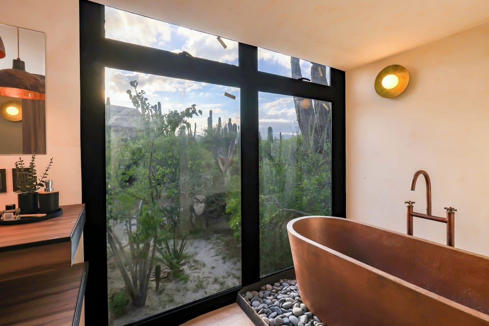Separate tub and shower, towels, soap, shampoo