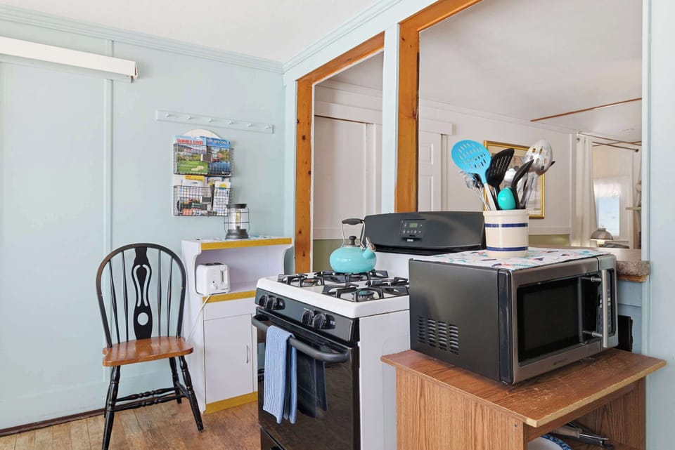 The gas range, microwave, and full counter space make it easy to cook a real meal without feeling cramped.