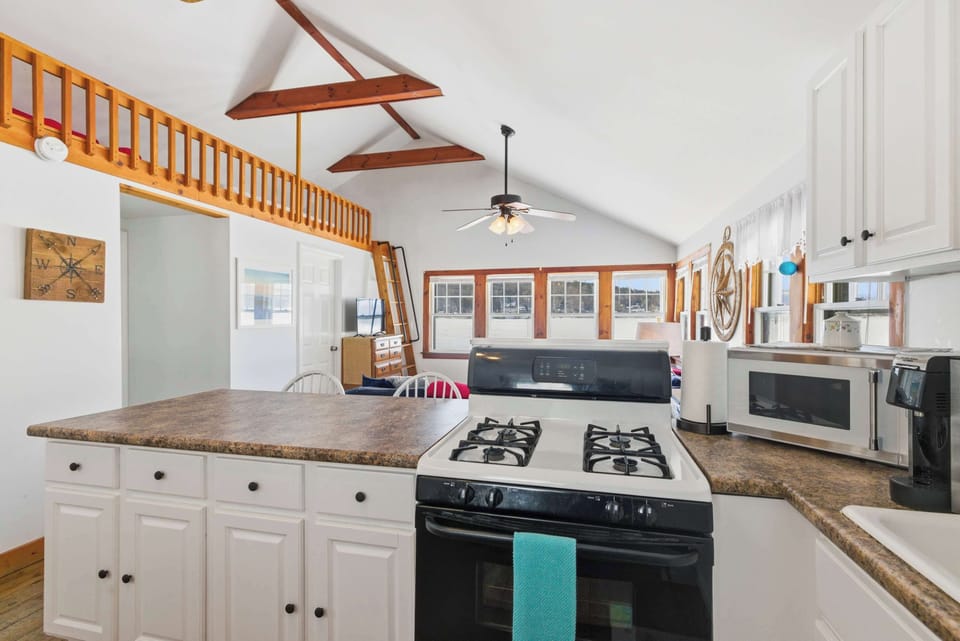 The gas range and full kitchen setup mean you can cook real meals here — whether that's a big breakfast before a hike or dinner after a long day on the lake.