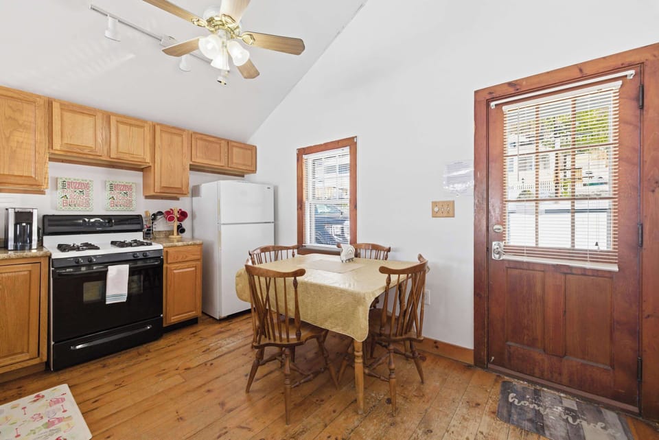 The gas range and private entrance are right off the kitchen — a practical, well-laid-out space for cooking real meals.
