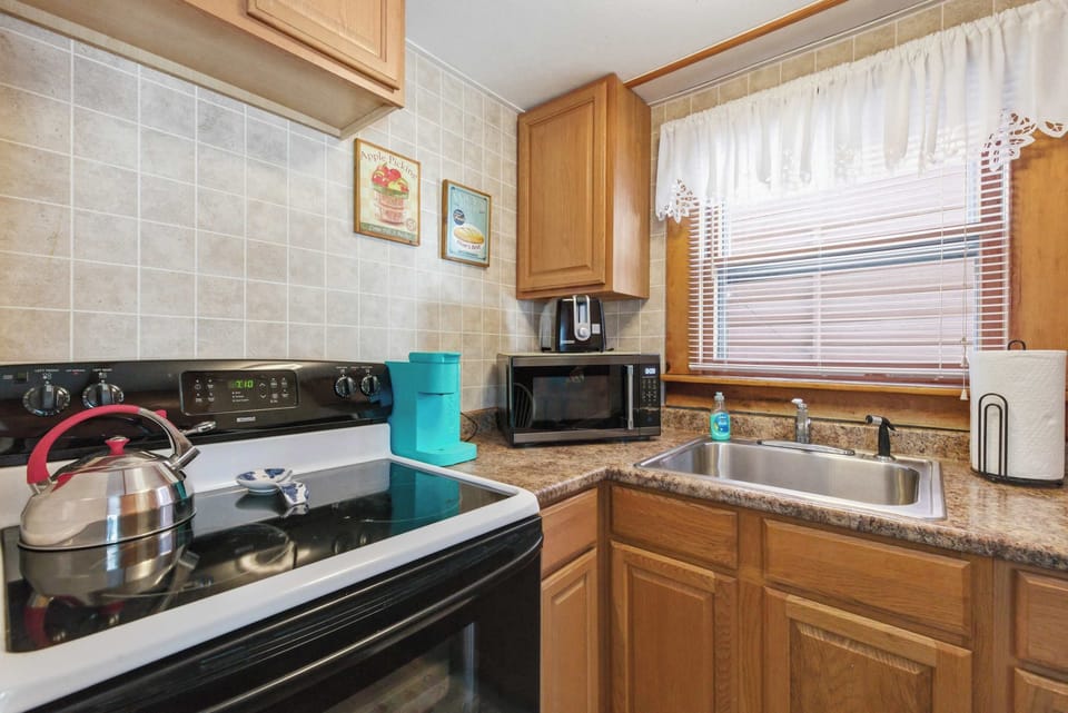 Everything you need is right there: range, microwave, and counter space without having to dig around for anything.