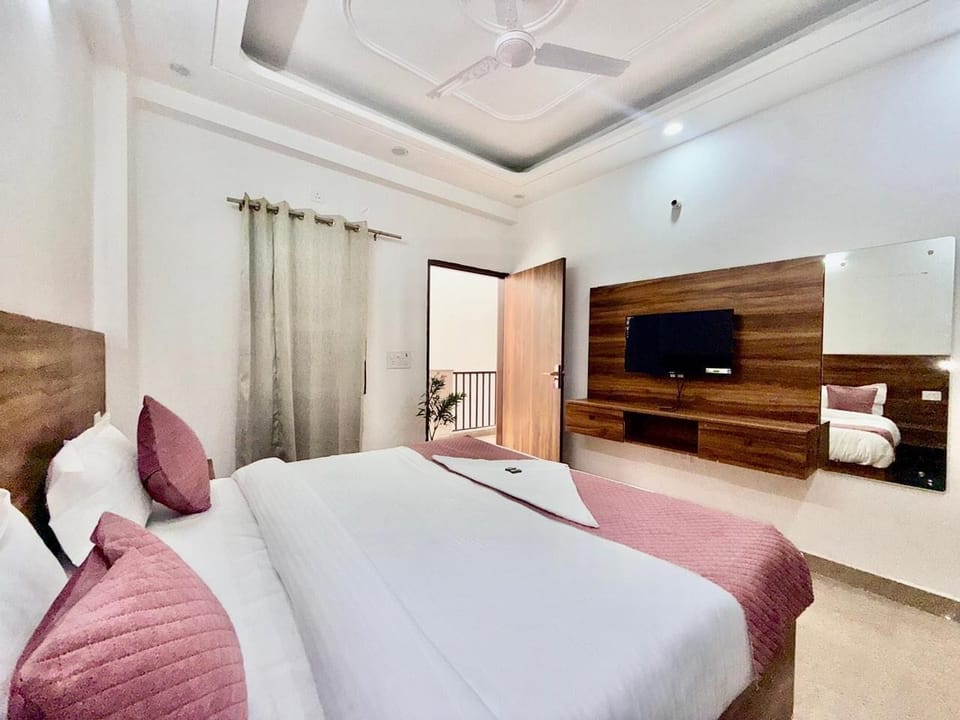 Deluxe Double Room, Balcony, City View | In-room safe, desk, laptop workspace, blackout drapes