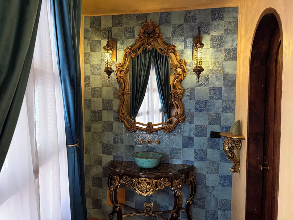 Luxury Room, Courtyard View | Bathroom | Shower, rainfall showerhead, hair dryer, towels