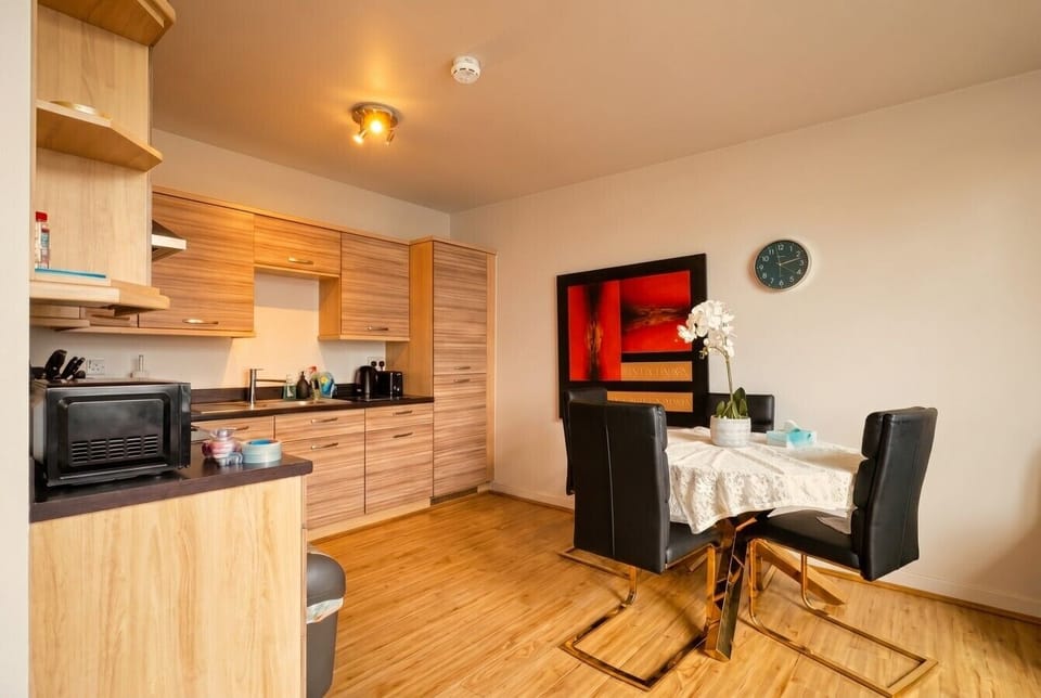 The kitchen opens straight to the dining table so cooking and chatting stay connected.