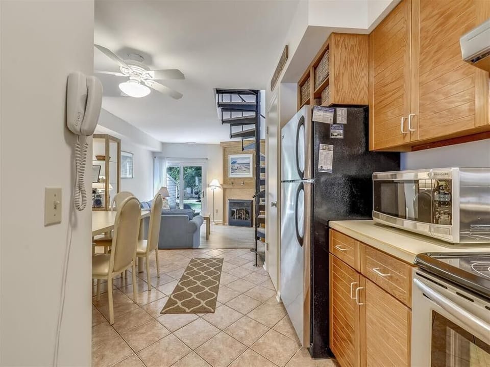 Step into a welcoming open layout, where kitchen and dining flow seamlessly into cozy living spaces.