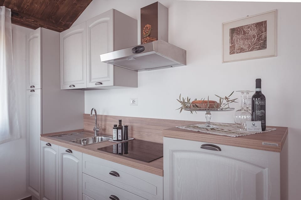 Family Condo, 1 Bedroom, Ground Floor (PIOPPO) | Private kitchen | Full-size fridge, stovetop, cookware/dishes/utensils, dining tables