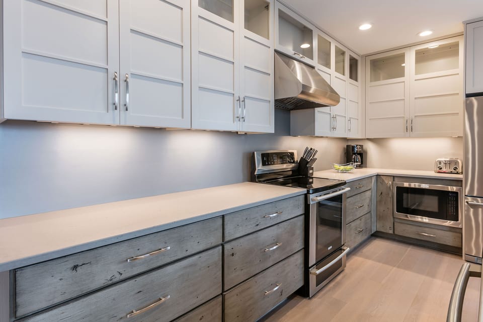 A modern, fully equipped kitchen makes meal preparation easy, with clean lines and ample counter space for group cooking.