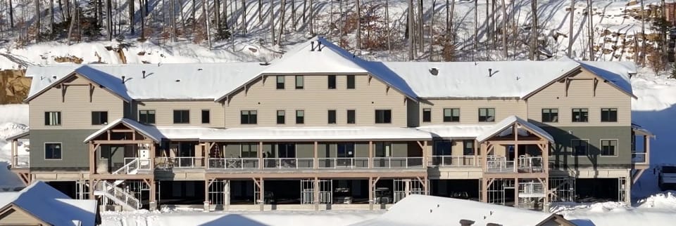 The exterior of this spacious South Face Village condo sets the tone for a comfortable mountain stay, with room for groups to gather and enjoy the alpine surroundings.
