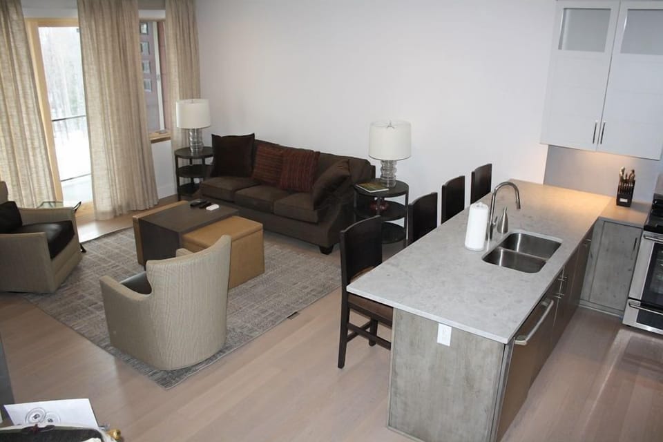 Gather in the open-concept kitchen and living area designed for comfort and connection.
