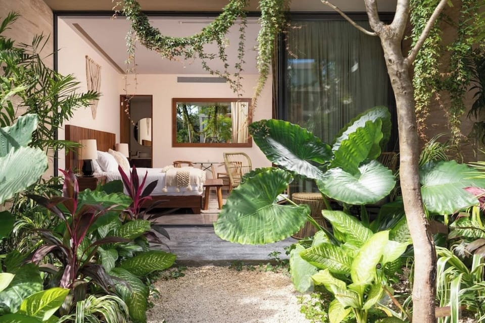 View from the outside towards the apartment. Guests have direct access to the patio and pool from the large window.