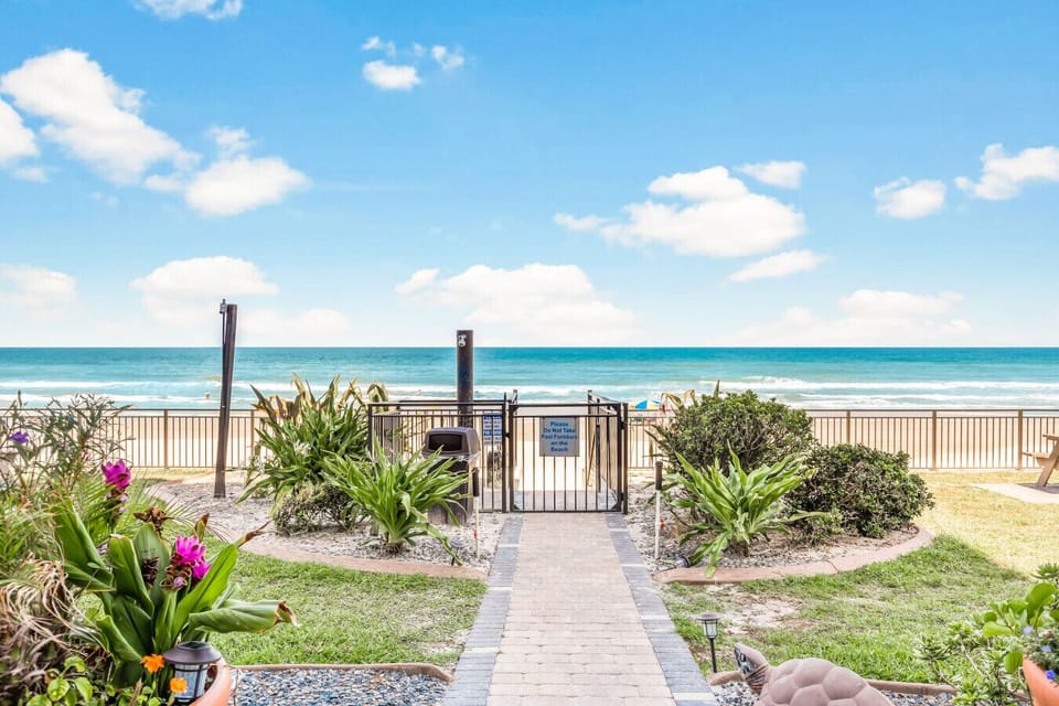 Gate to beach and beautifully landscaped beachfront