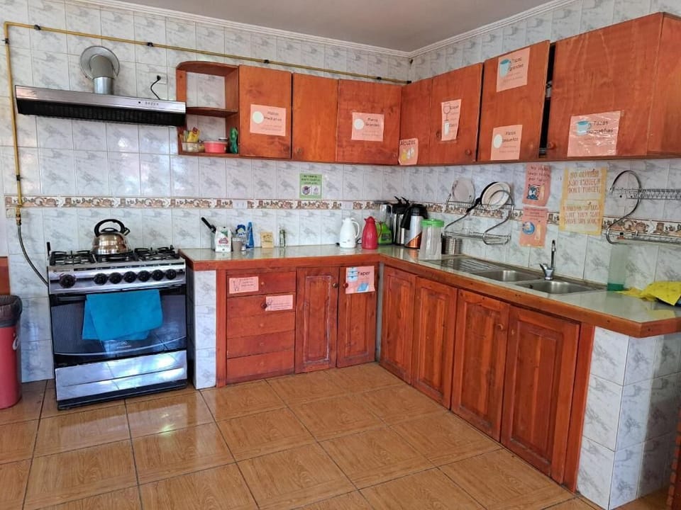 Full-size fridge, microwave, stovetop, cookware/dishes/utensils