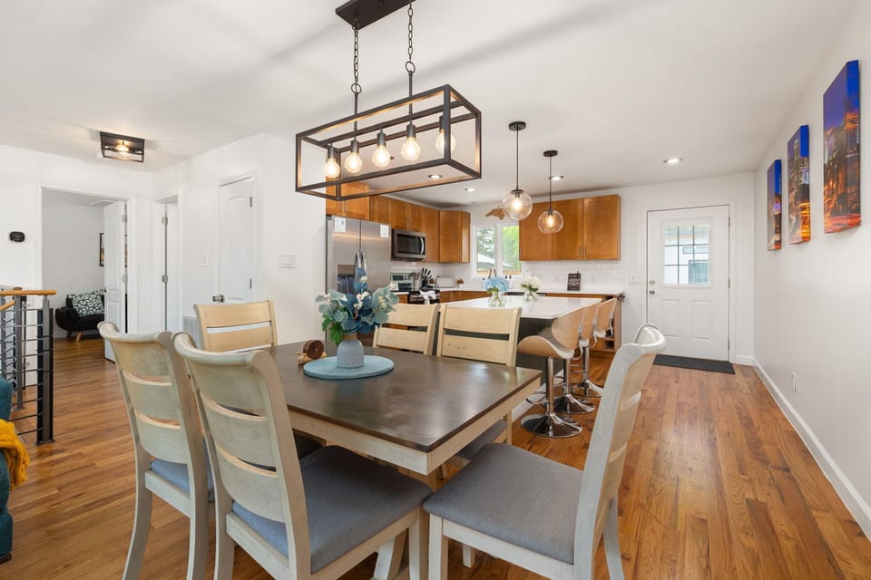 Bright open dining area with modern kitchen and island seating