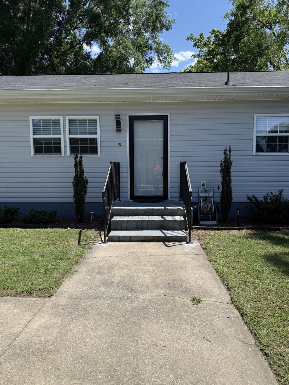 Welcoming front entry with easy walkway and tidy curb appeal
