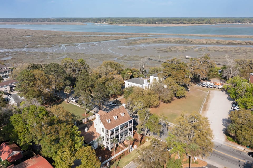Experience the elegance of Circa 1785 from a bird's-eye view, where historic charm meets a serene coastal setting.