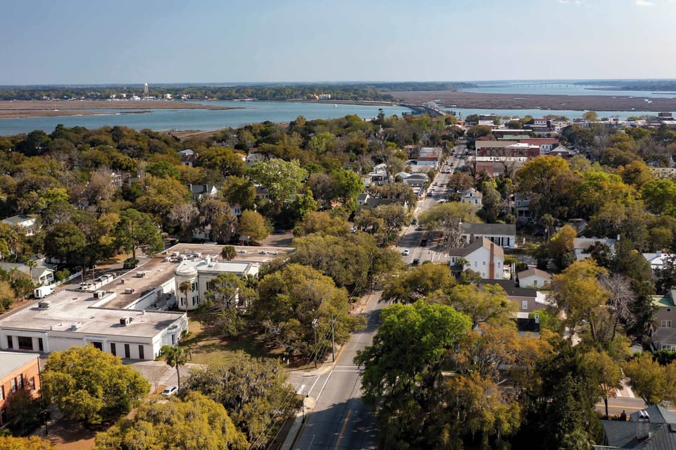 Experience the elegance of Circa 1785 from a bird's-eye view, where historic charm meets a serene coastal setting.
