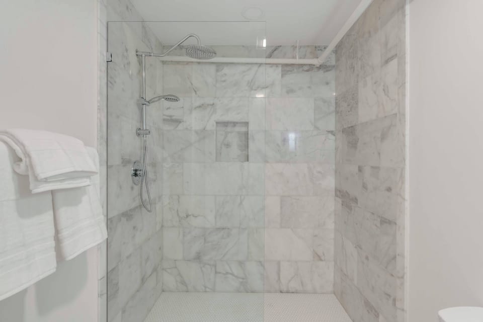 Bathroom #1: Refresh in your private ensuite bathroom featuring a spacious walk in shower and elegant finishes.