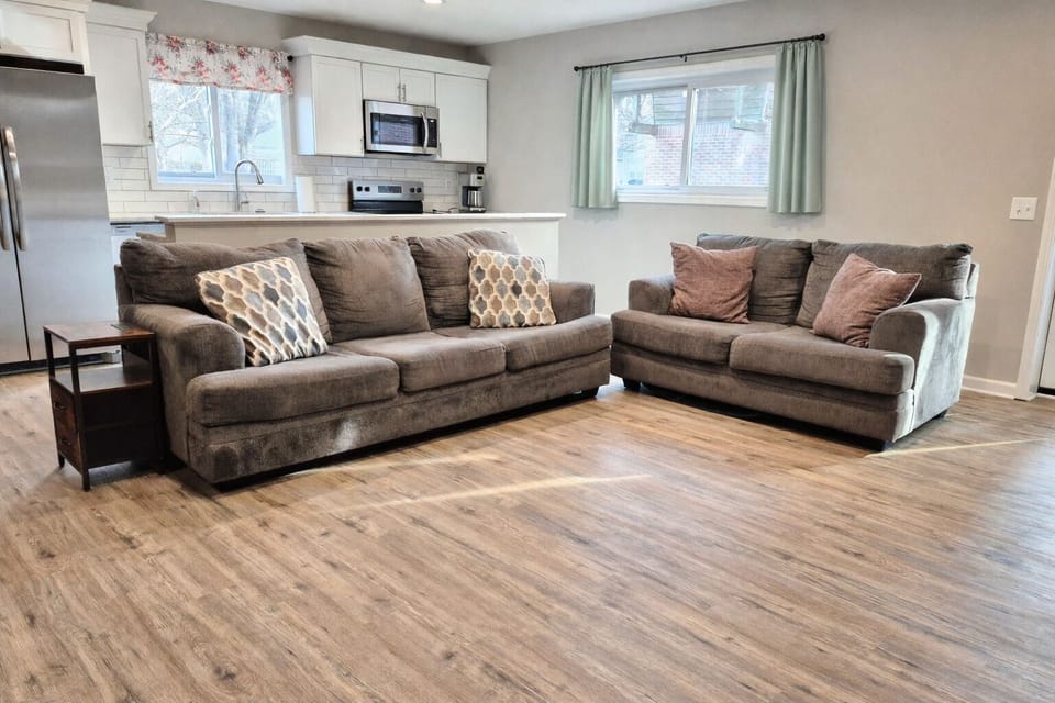 Living area with full kitchen in the background