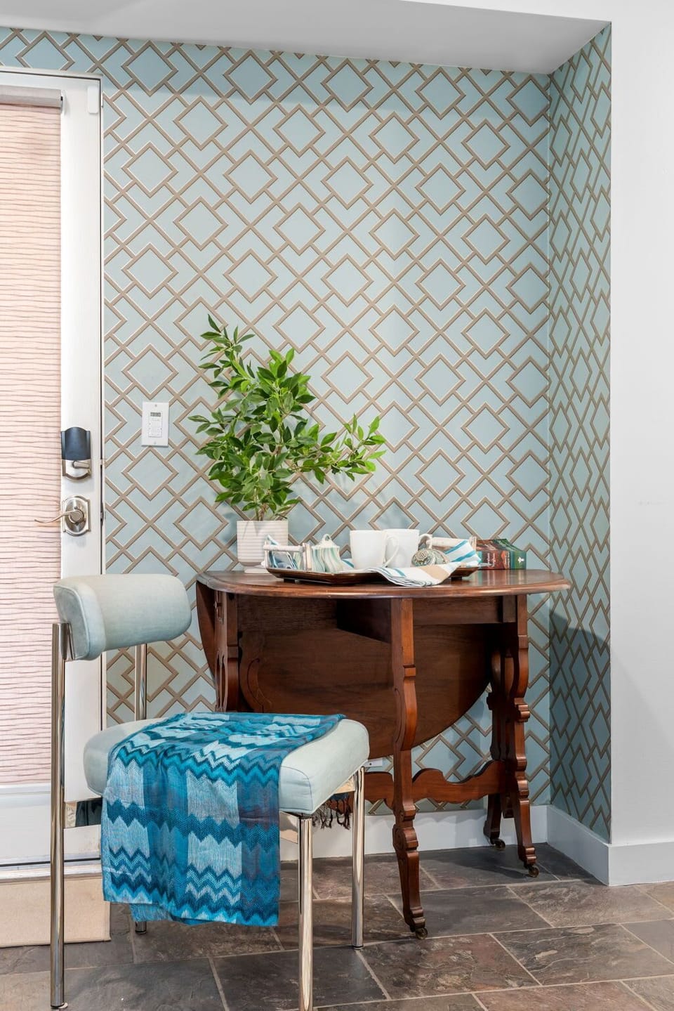 Quiet reading and tea corner inside the bedroom with decorative accent wall. A peaceful spot to enjoy coffee or catch up on work.
